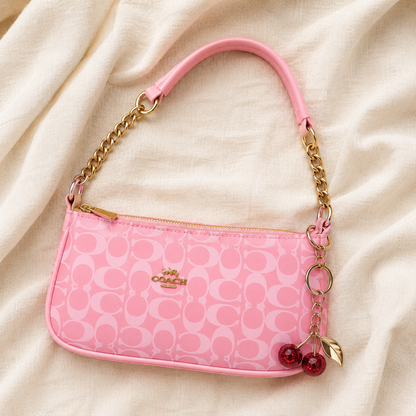 Rosie — Signature Pink Coach Bag with Cherry Charm